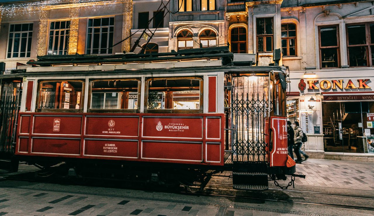 Tram moving past medieval buildings in Old Town Tallinn