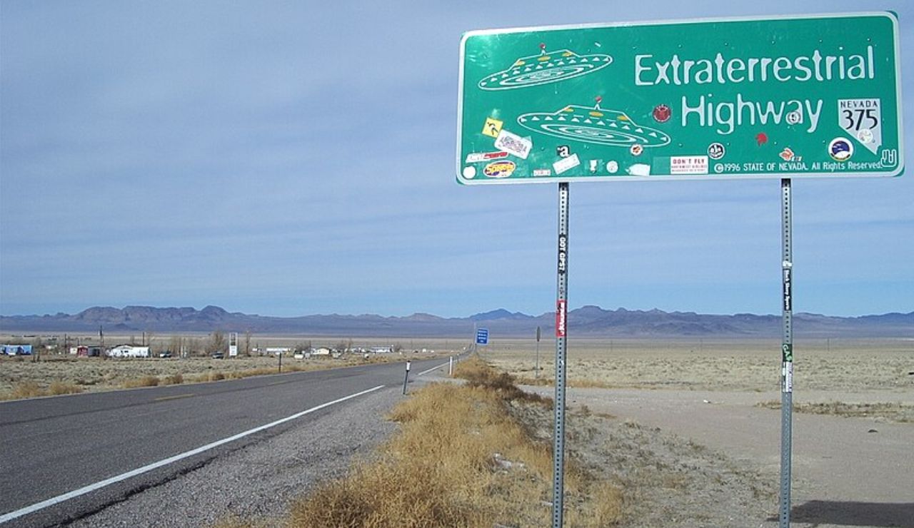 Extraterrestrial Highway sign on Nevada State Route 375 with UFO illustrations.