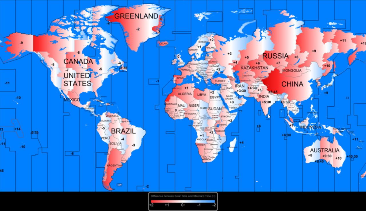 World map showing time zones with red and white gradient shading, indicating deviations from standard time in various countries. Blue vertical lines represent the official time zone divisions.
