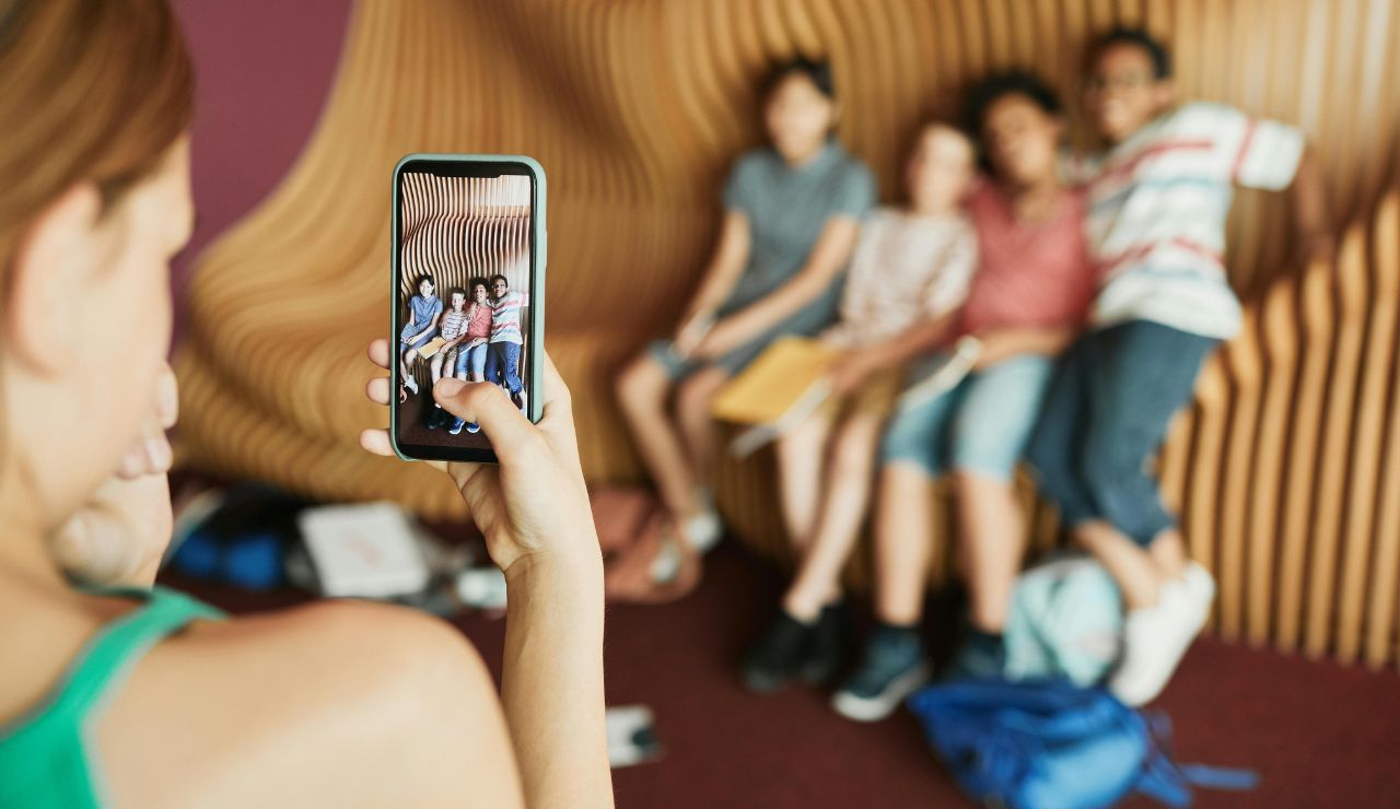 Tourist taking pictures of children at foreign school