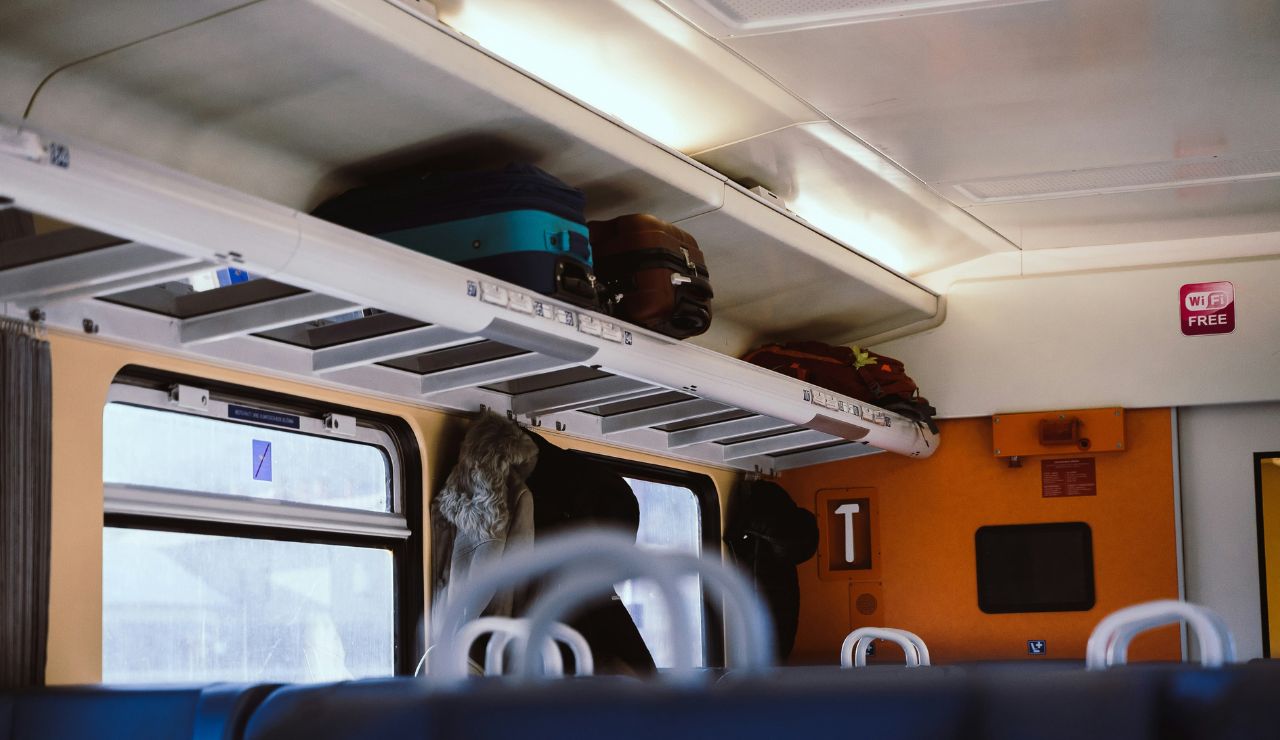Overhead luggage rack inside an Italian train carriage