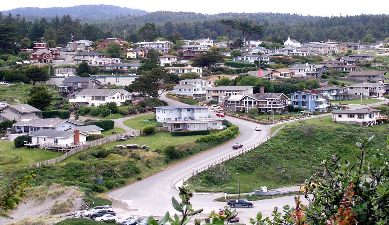 Hillside coastal neighborhood with charming homes and lush greenery.