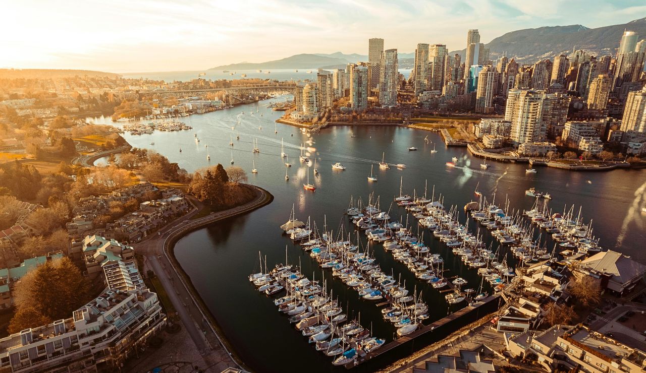 Waterfront view of Vancouver with mountains and reflections in the water