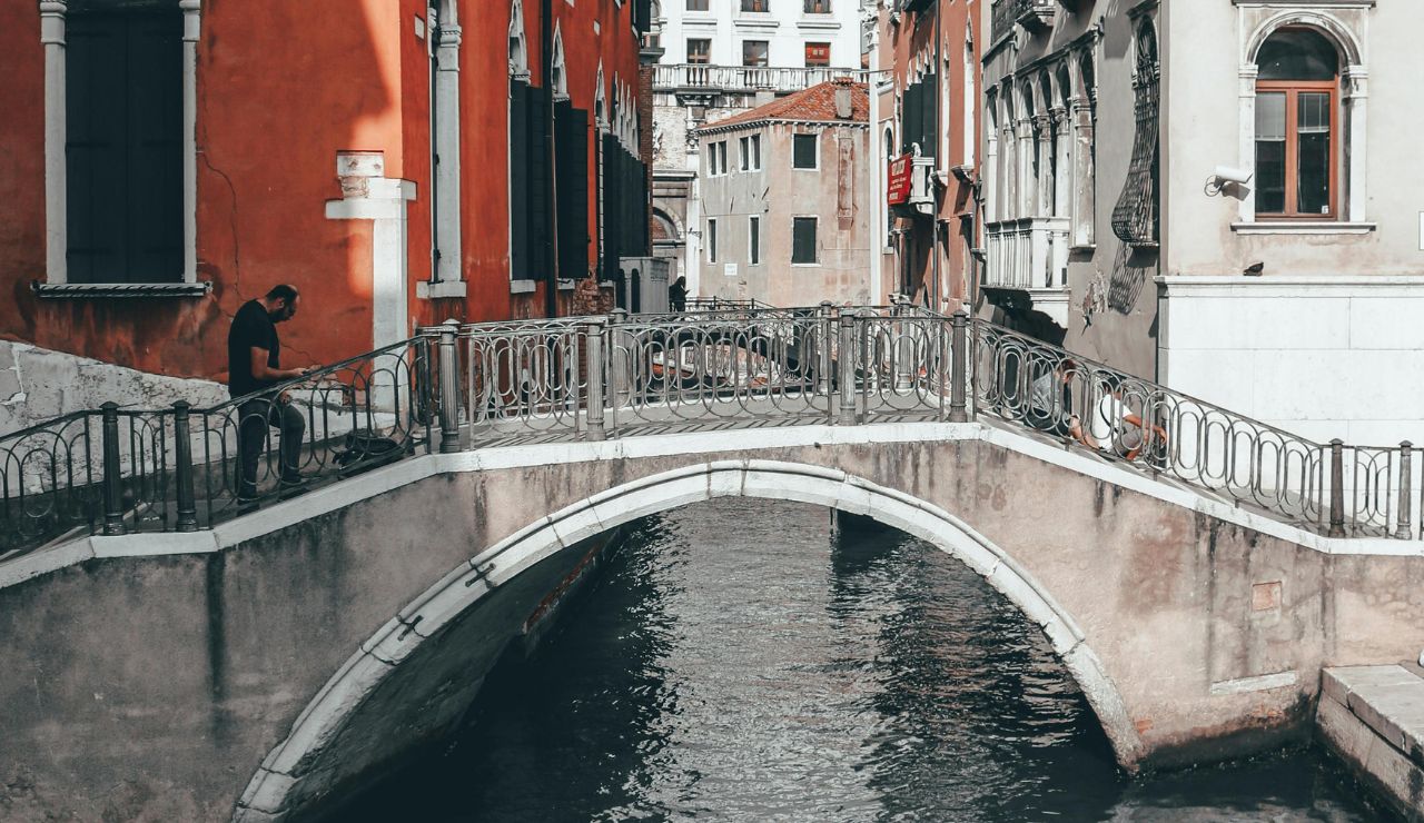 Flooded walkway along canal in Venice