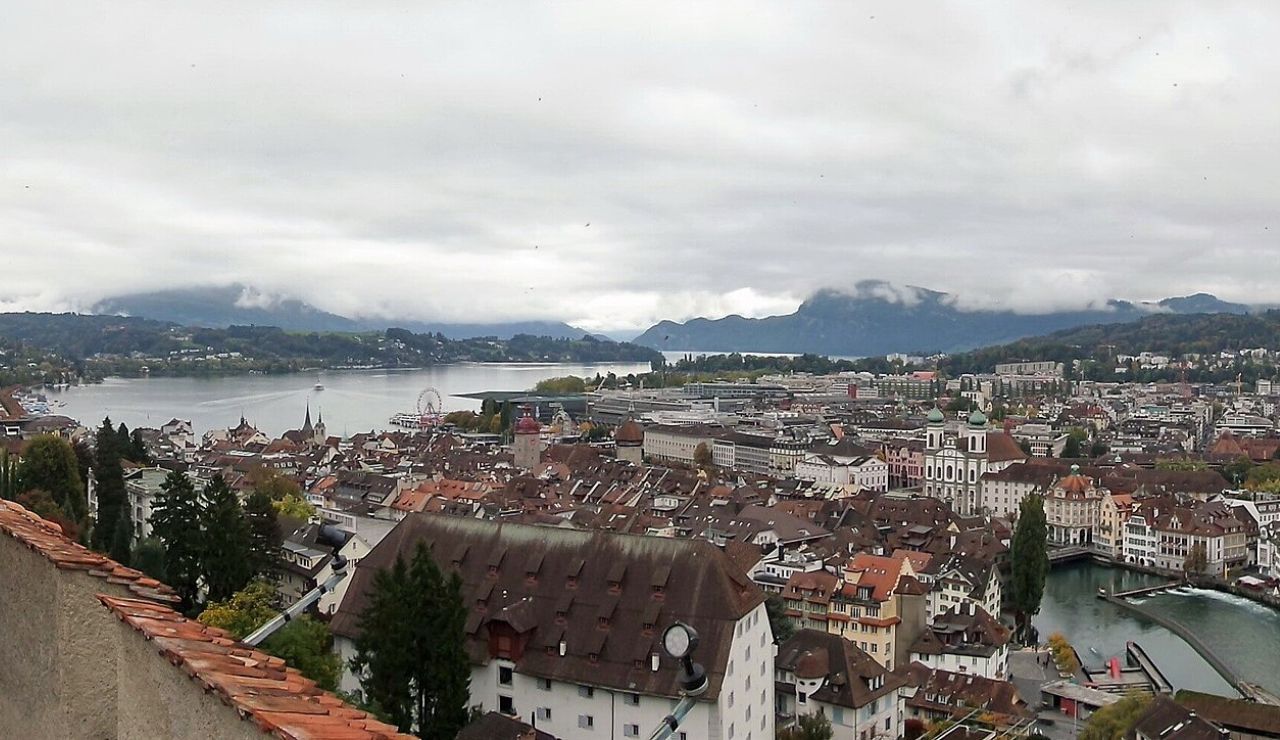Panoramic view of Lucerne, Switzerland with Lake Lucerne and Alpine mountains.