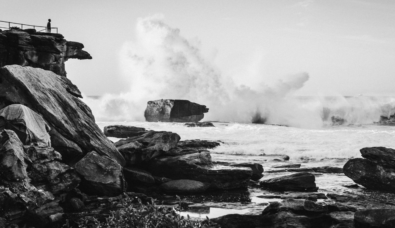 Natural Bridges section with rugged cliffs and foaming sea