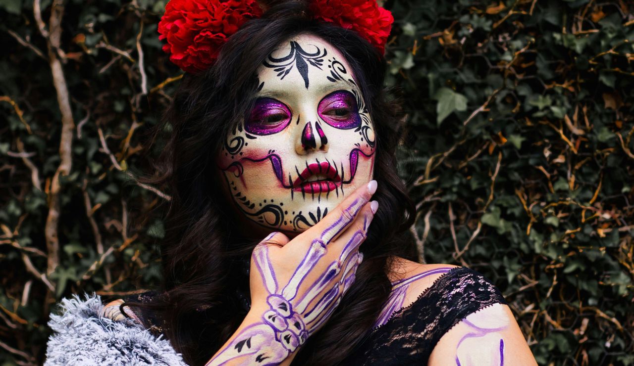 People with painted skull faces during Day of the Dead in Mexico.