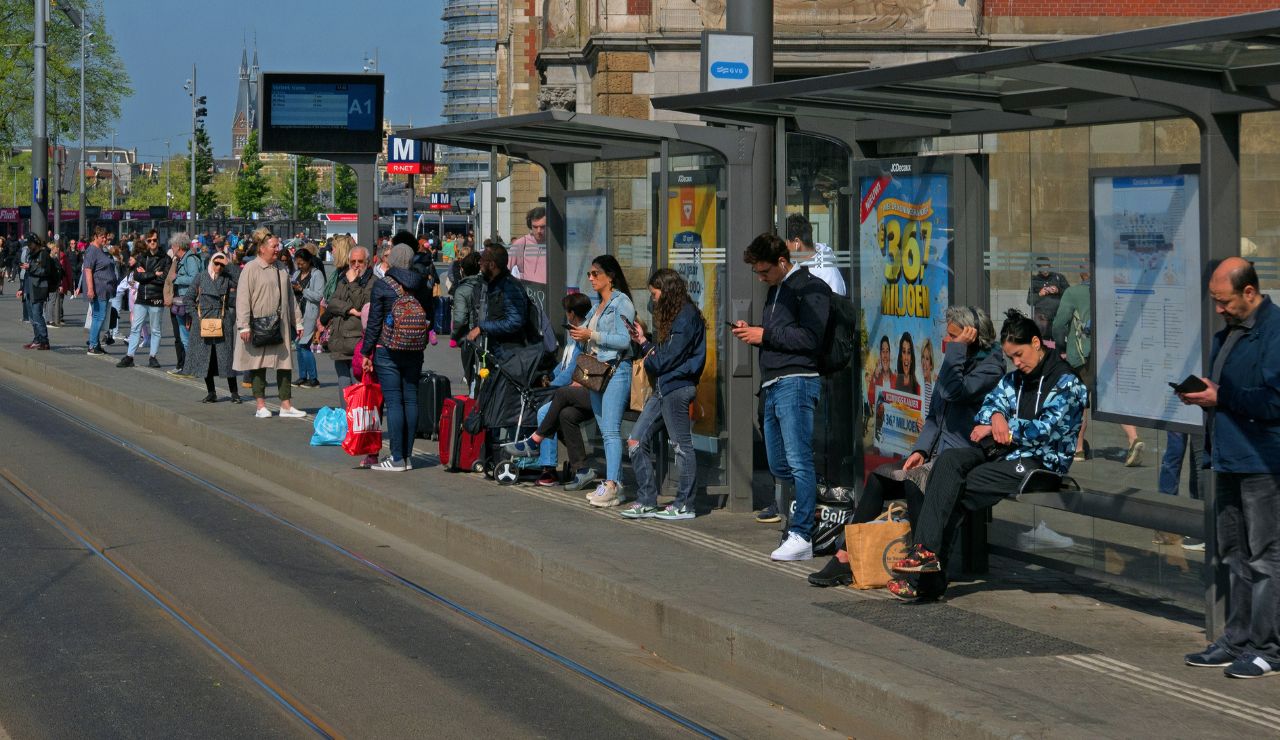 Travelers lined up at a busy intercity bus station