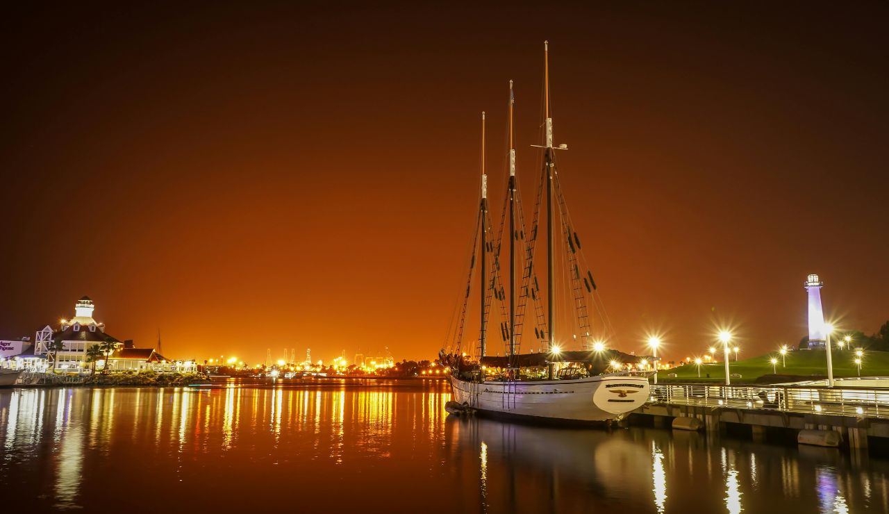 Historic seaport view with tall ships