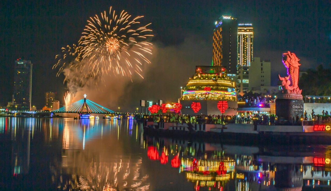 Night cityscape of Da Nang with vibrant lights and modern skyline.