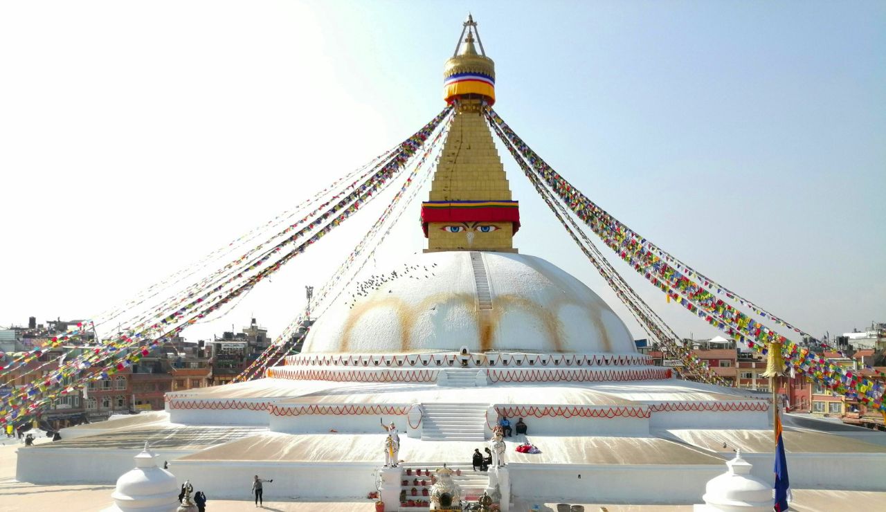 prayer flags and temple rooftops in Kathmandu Valley.