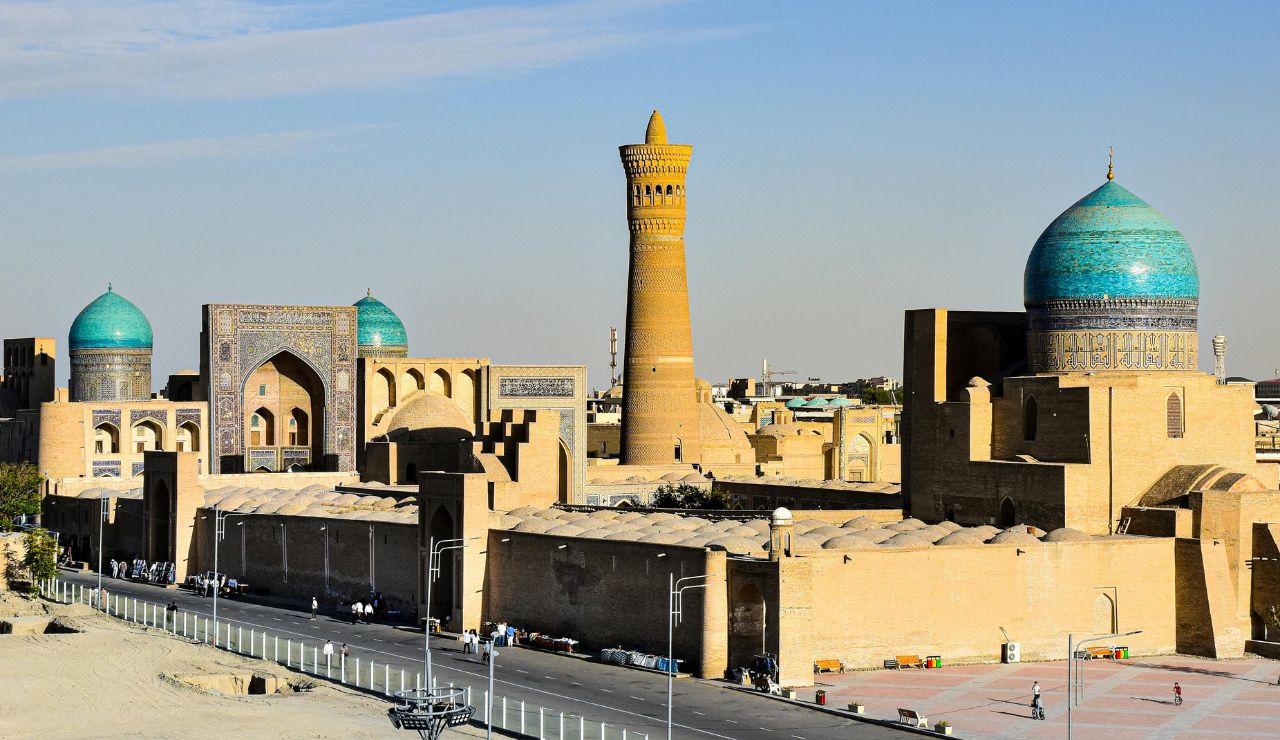 ancient madrasa under desert sky in Bukhara.