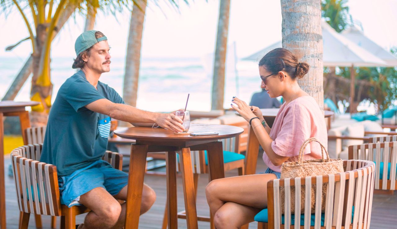 Couple enjoying breakfast in an overwater bungalow in Bora Bora.