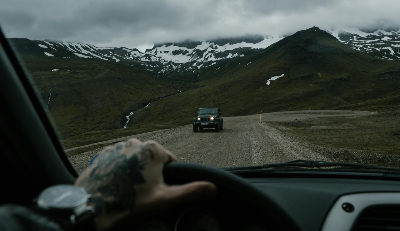 Car heading into winter storm clouds