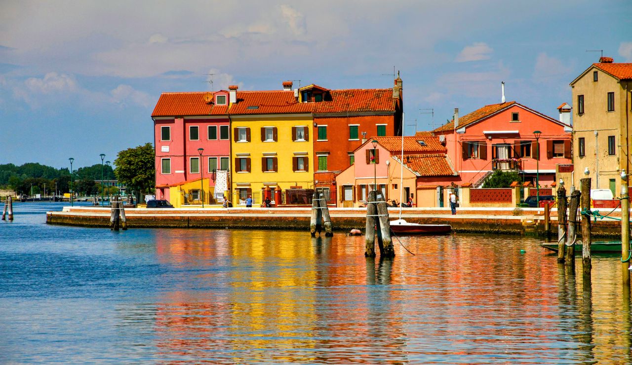 Brightly painted stilt houses above the tide on Chiloé Island, Chile