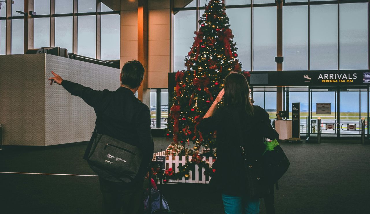 Couple exiting the airport, excited about their first post-flight activity.