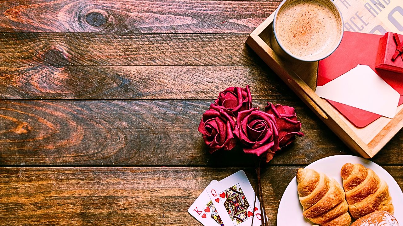 Romantic café setting with lattes and flowers, perfect for couple travel.