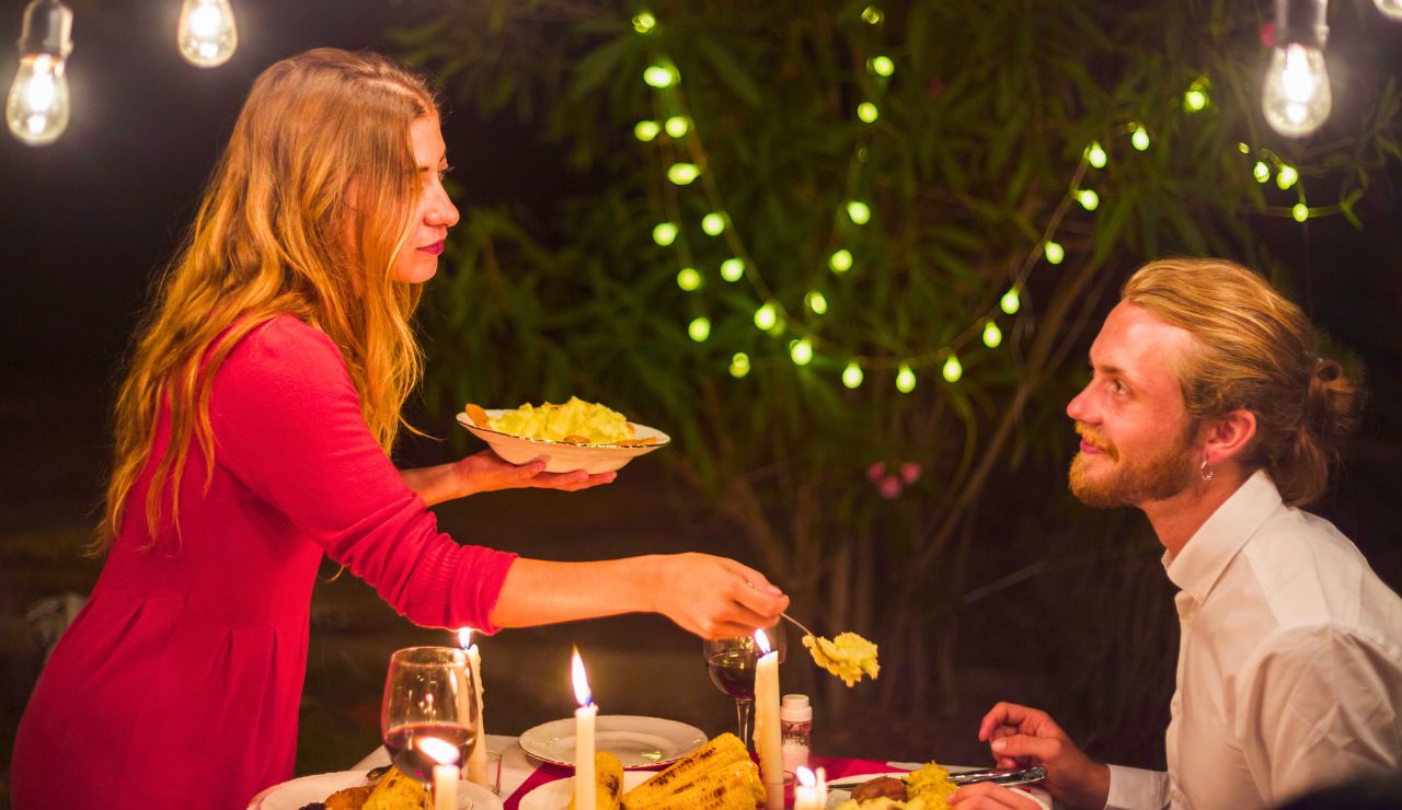 Couple enjoying a candlelit dinner on the beach in Tulum.