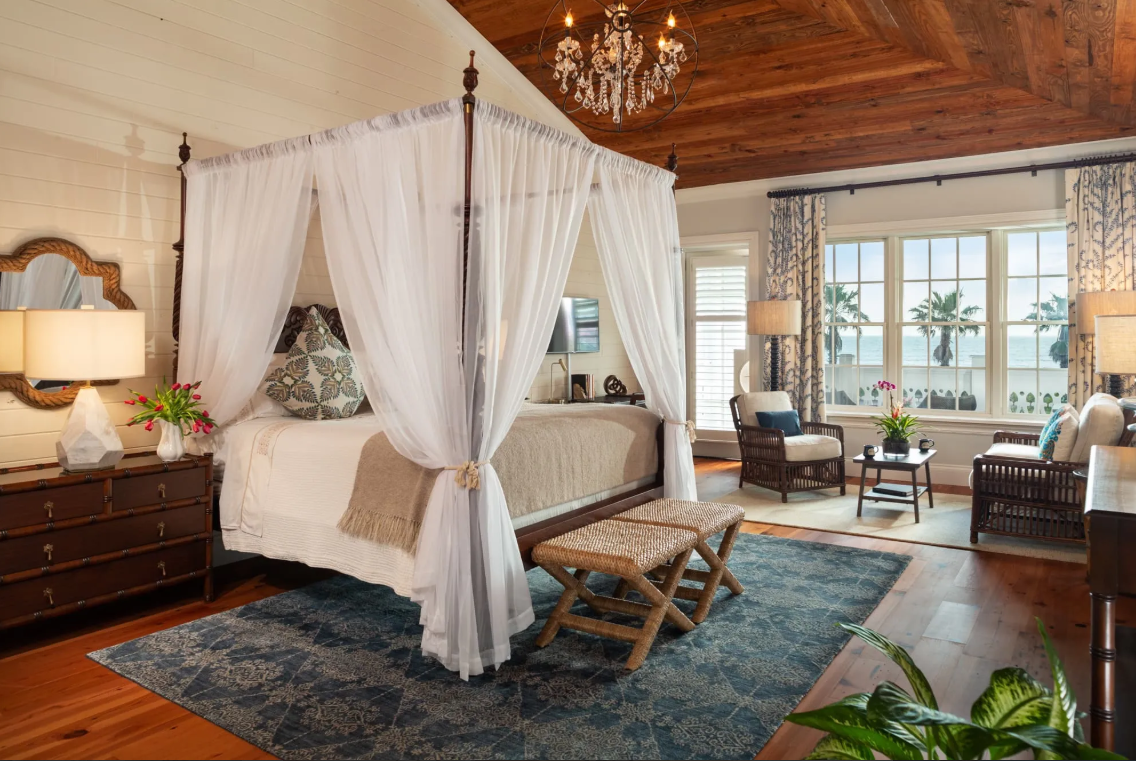 Beautiful bedroom suite in Port D'hiver Bed & Breakfast with ocean views and canopy.