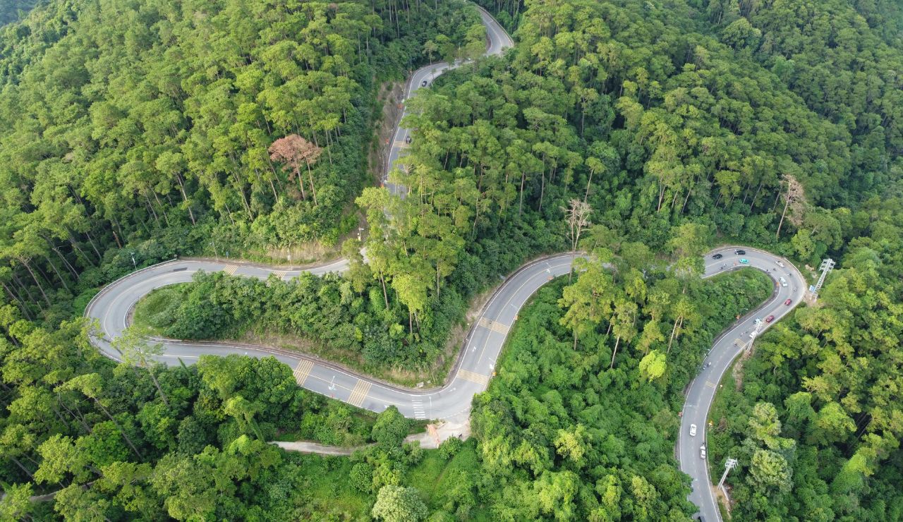 Motorbike riders on scenic mountain road in northern Thailand