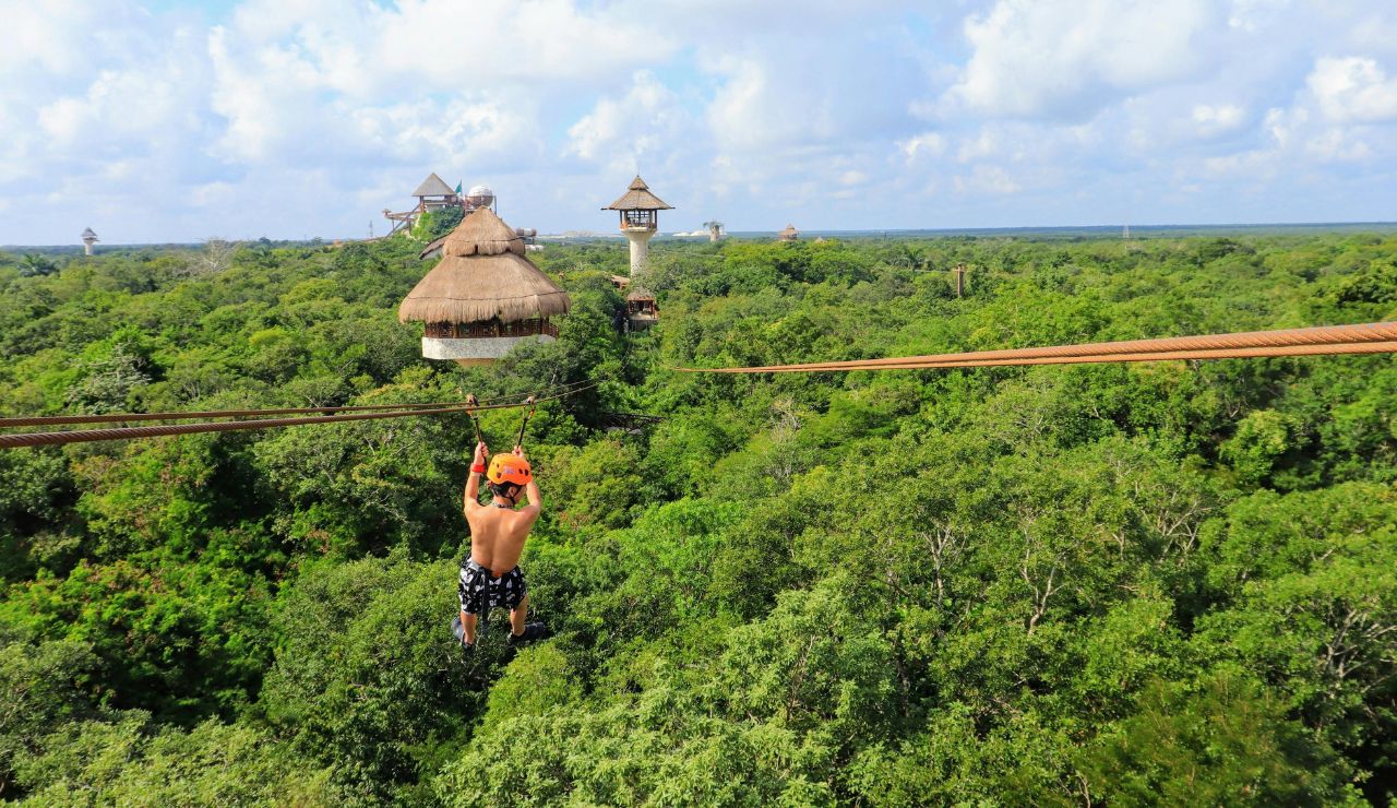 Tourist ziplining over forest in Pai, northern Thailand