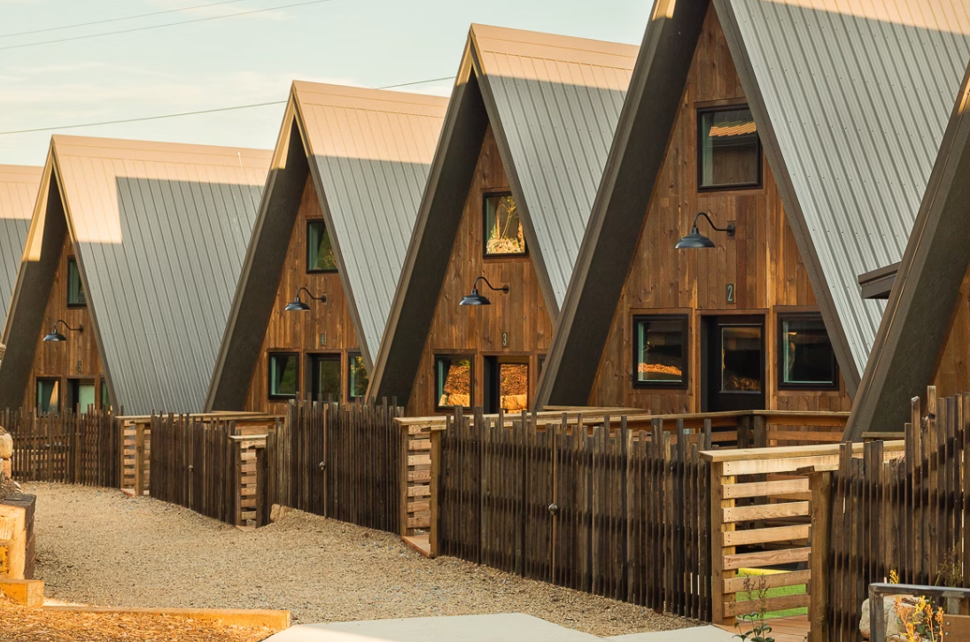 A row of A-frame cabins at Wrong Way River Lodge & Cabins, one of the most romantic cabins in Asheville NC.