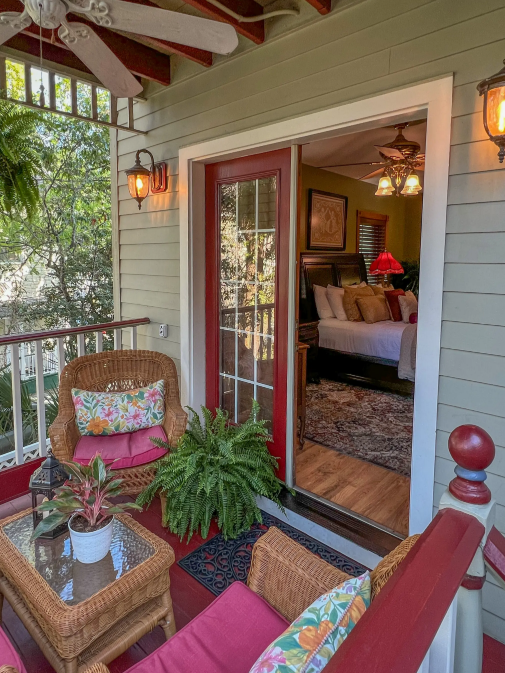 Guest room with patio seating at Cedar House Inn Victorian Bed & Breakfast.