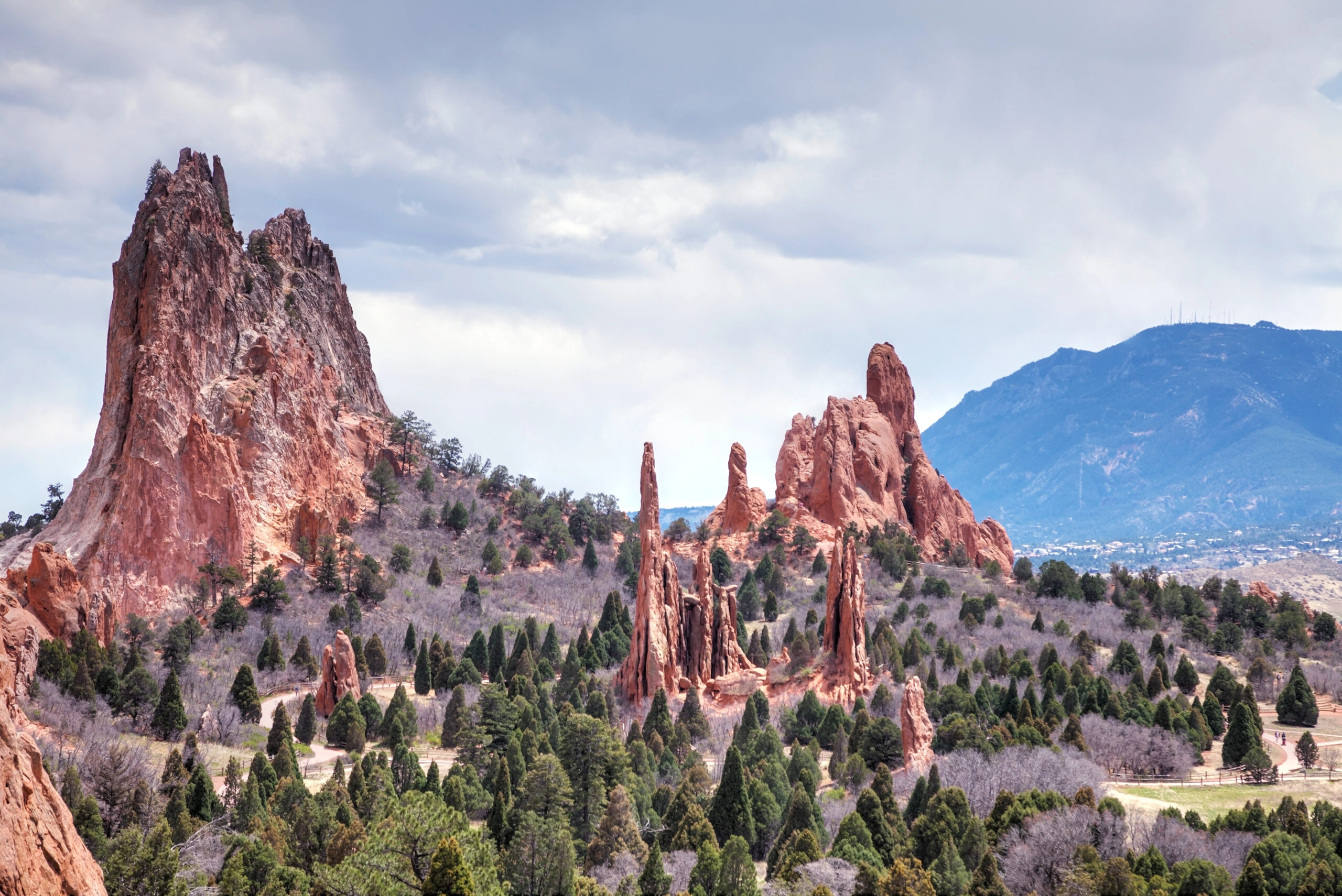 Red sandstone rocks and scattered trees fill Garden of the Gods, one of the most romantic getaways in Colorado Spings.