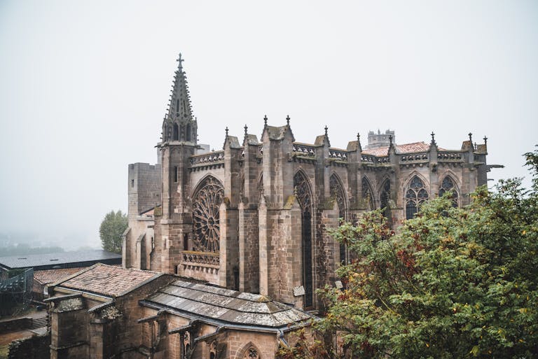 Stunning Gothic architecture of Carcassonne Cathedral in France on a misty day.