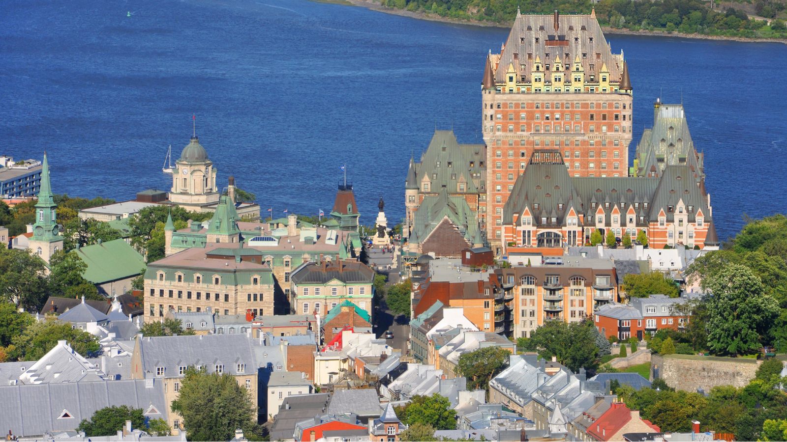 Aerial view of Quebec City showing Château Frontenac and historic buildings beside the St. Lawrence River.