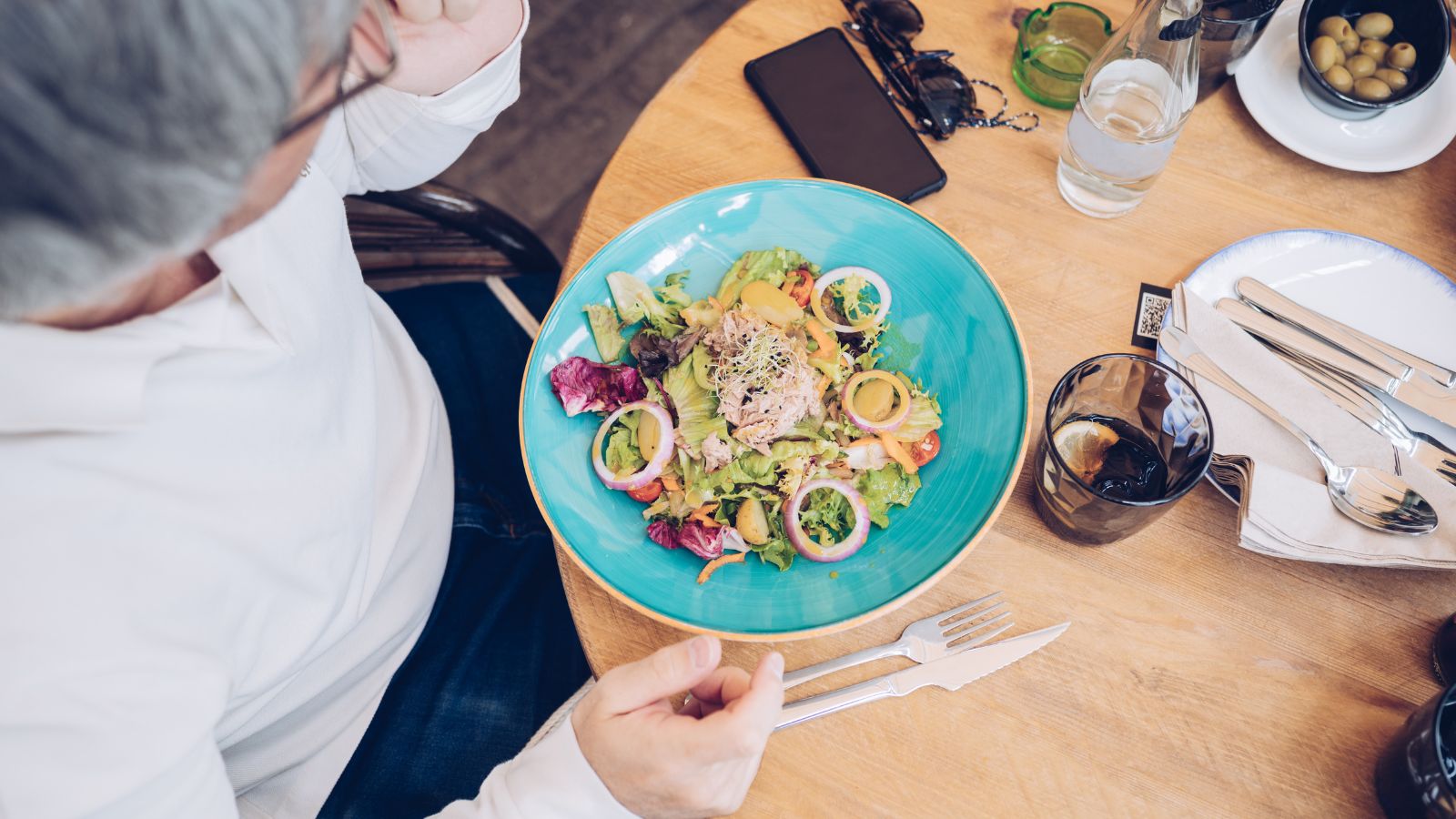 A photo of a colorful plate of unfamiliar food with curiosity.