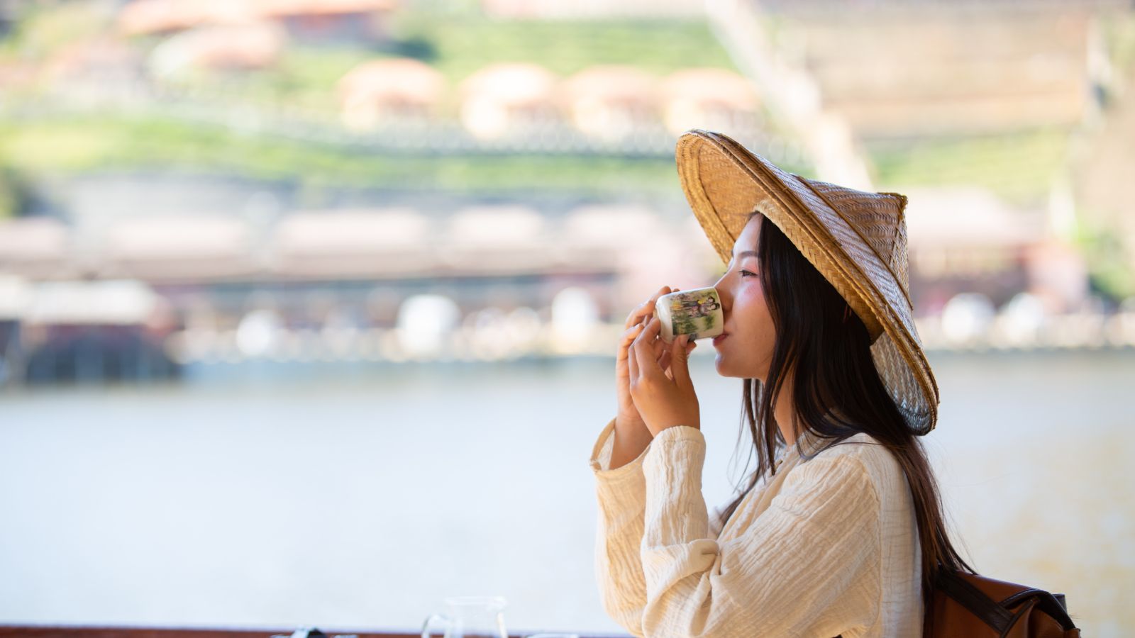 A photo of Traveler sipping water or herbal tea.
