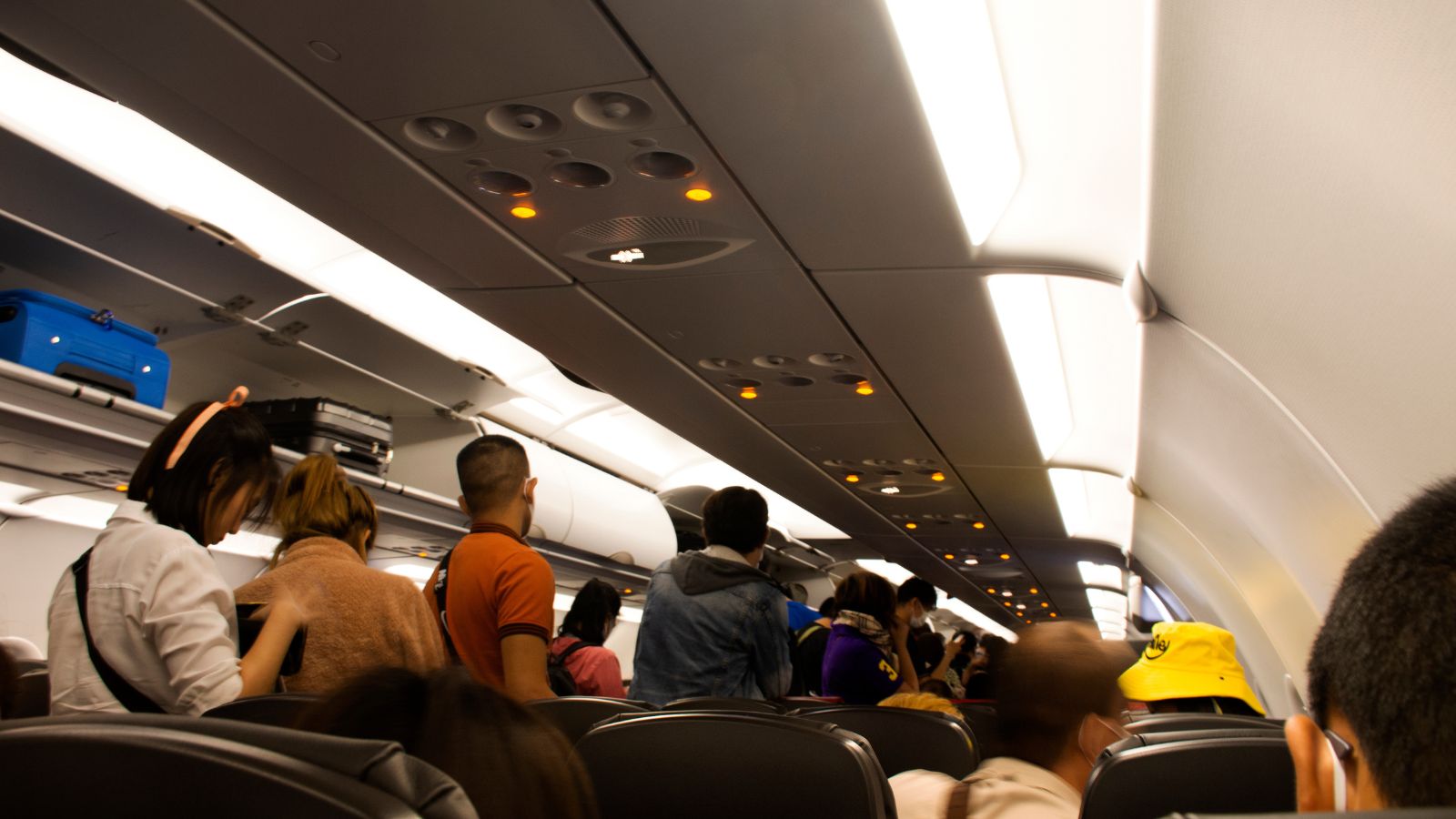 A picture of passengers in the plane that are not seated