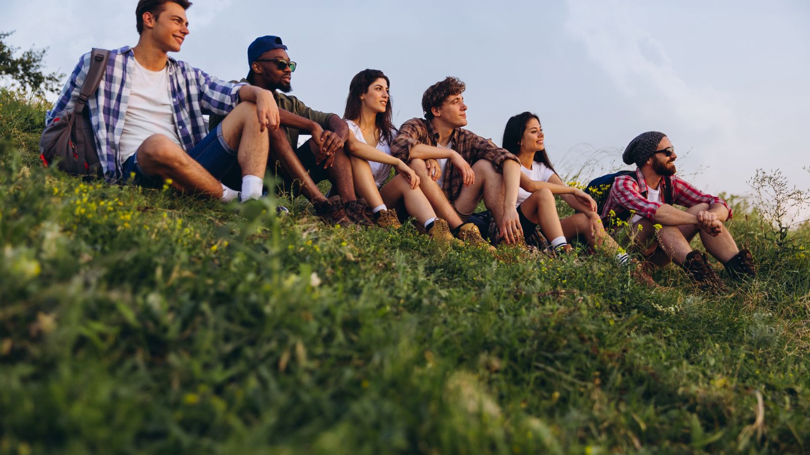 A group of travelers relaxing and enjoying the view