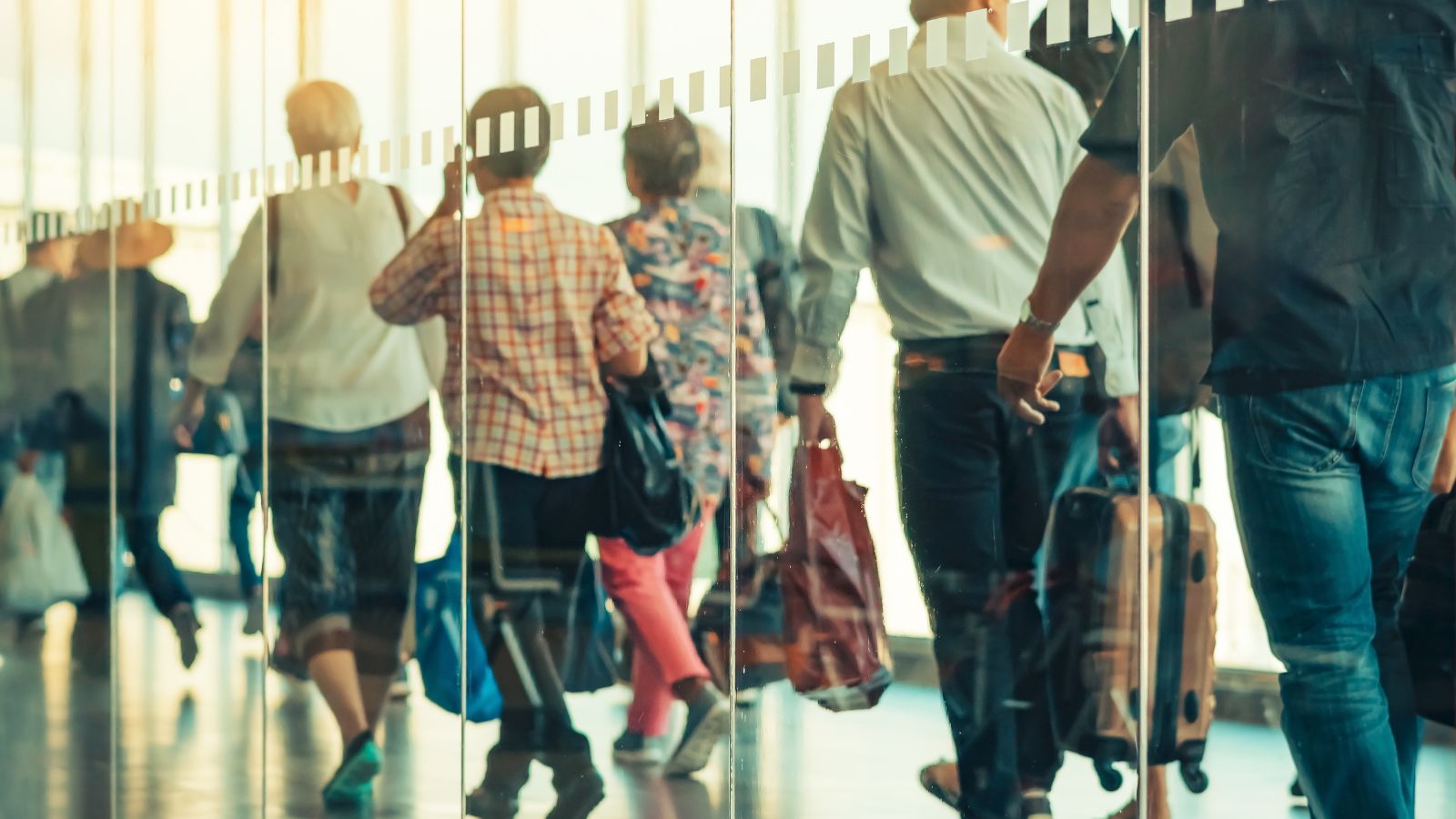A photo of constant movement of passengers in airport.