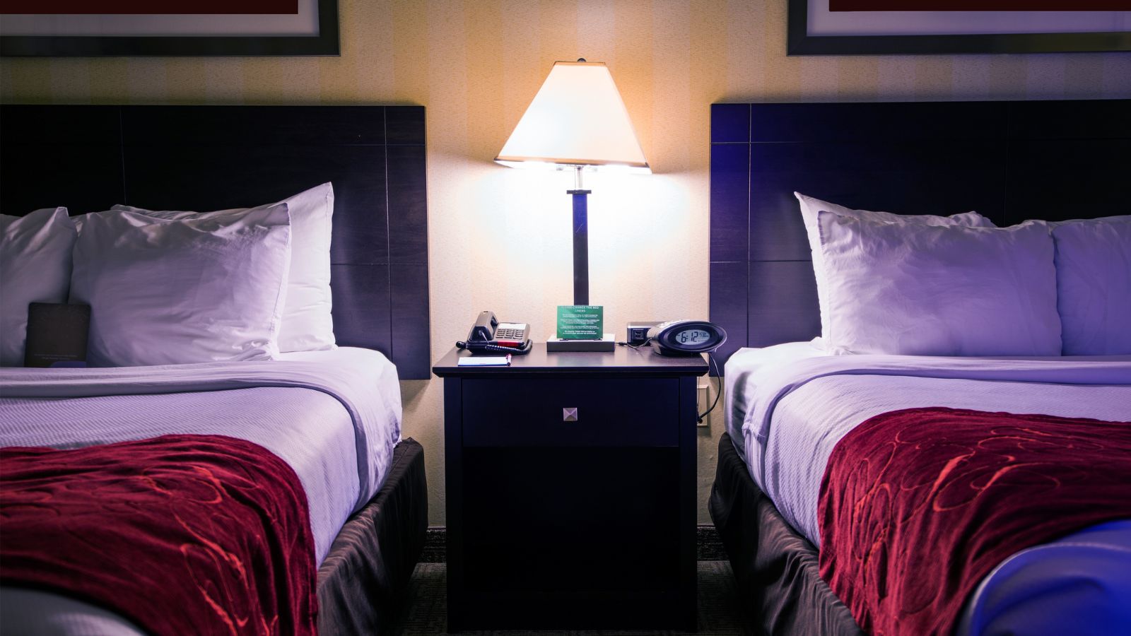 A photo of a two hotel queen bed.