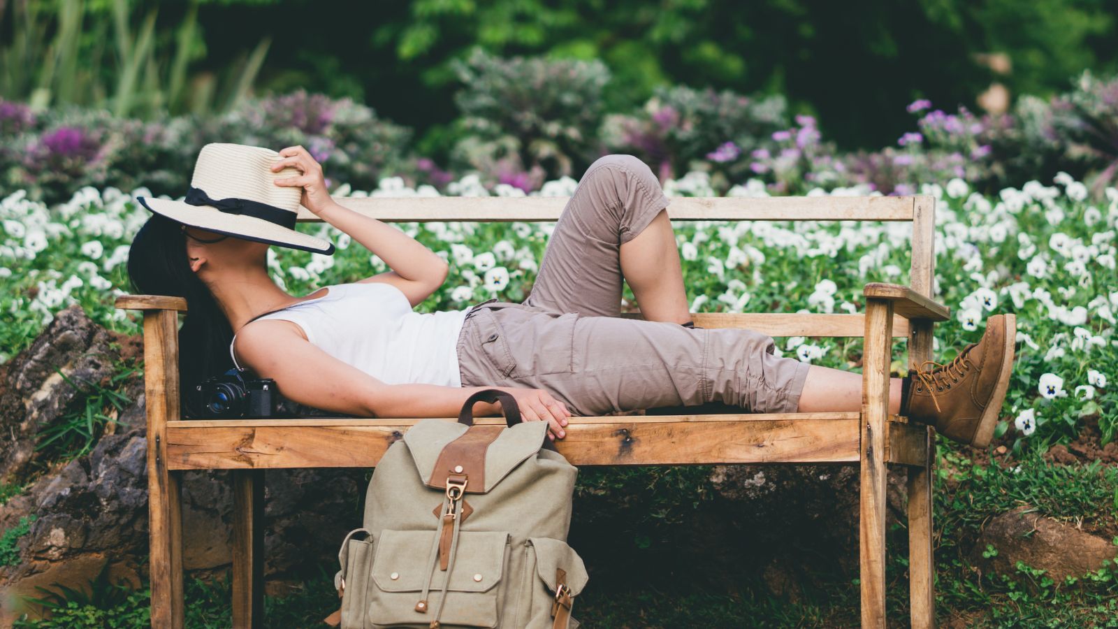 A photo of a Relaxed traveler in park.