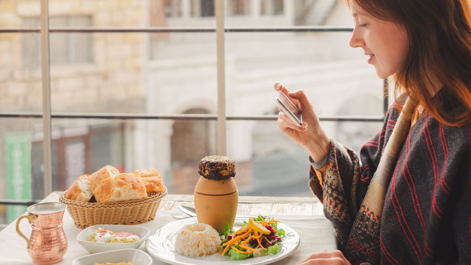 A photo of a Traveler enjoying gourmet local meal.