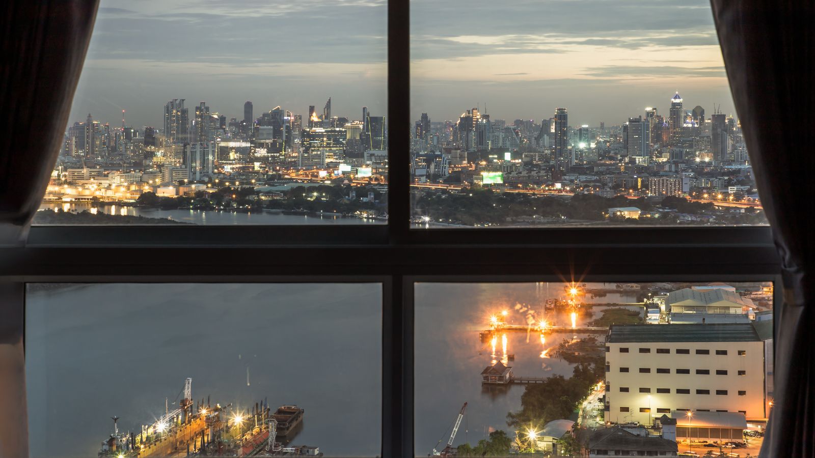 A photo of a Hotel room city skyline view.