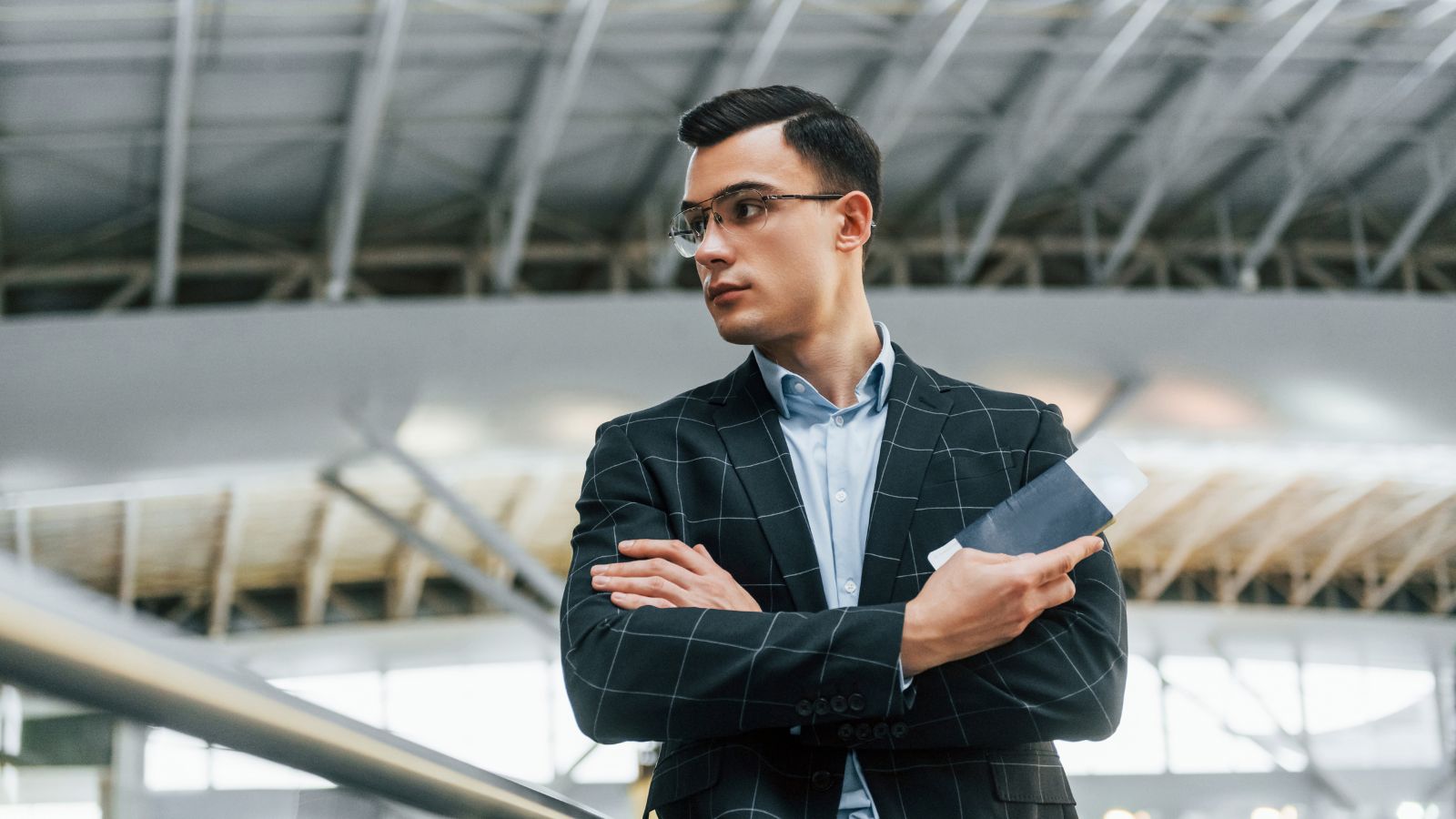 A photo of an First-time international traveler standing in immigration line at airport.