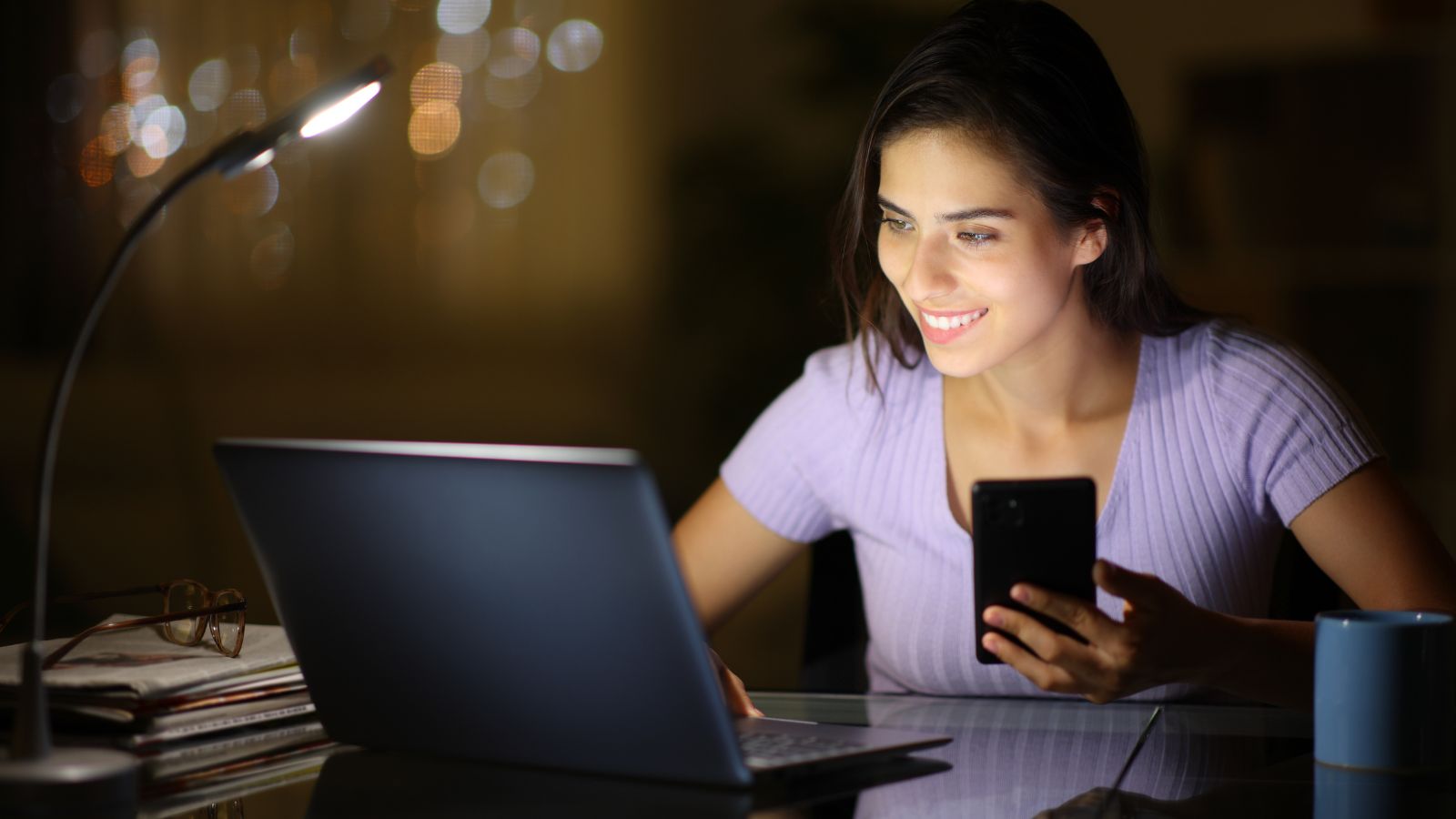 A photo of a traveler Traveler booking an international flight on a laptop late at night.