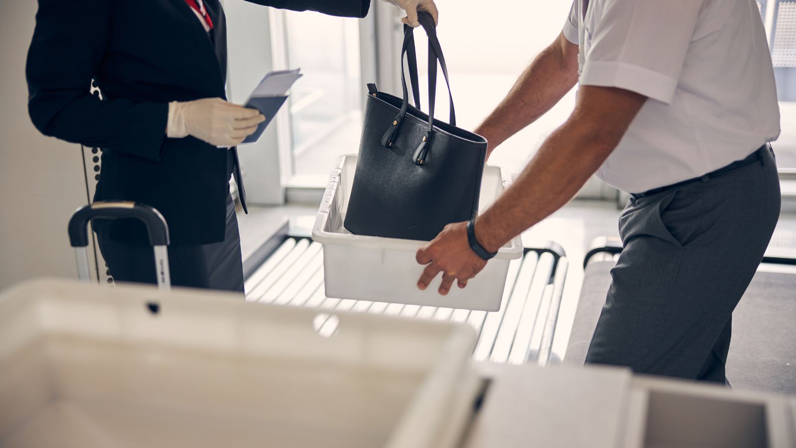 A photo of an Airport security bag inspection.