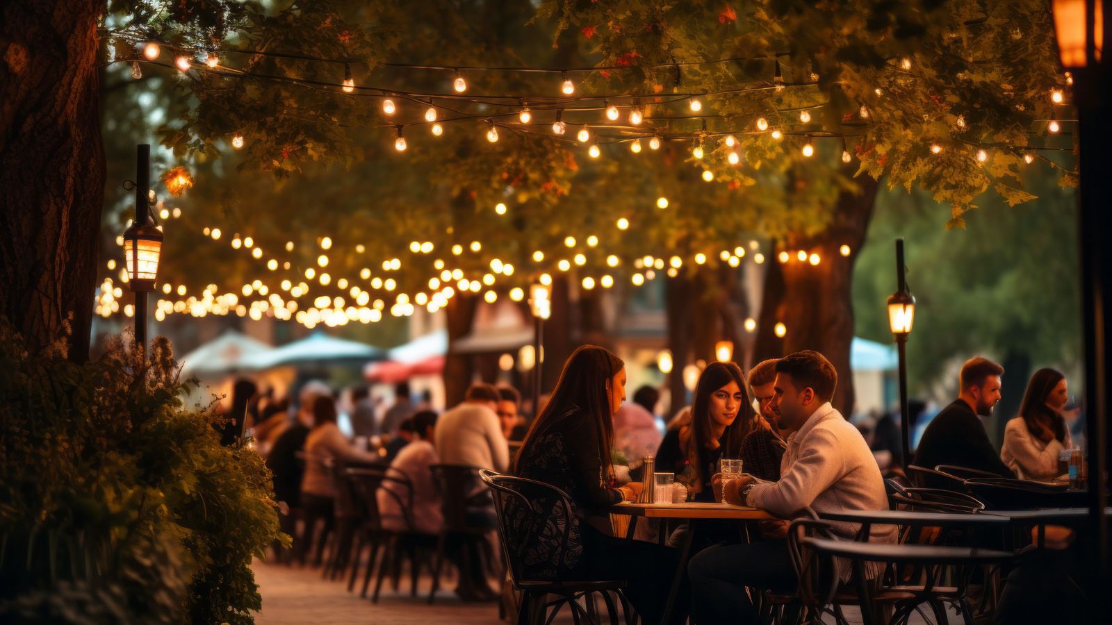 A photo of Romantic destination during Valentine’s Day, busy sidewalk with couples, full café patios and restaurants.