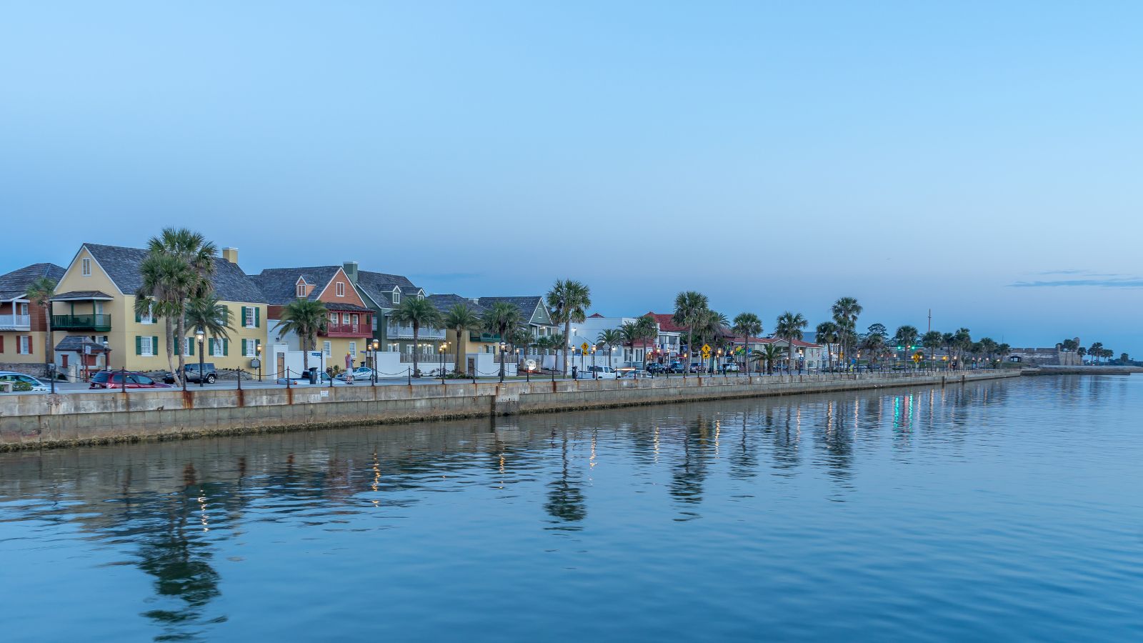 A photo of a Quiet seaside boardwalk at sunset.
