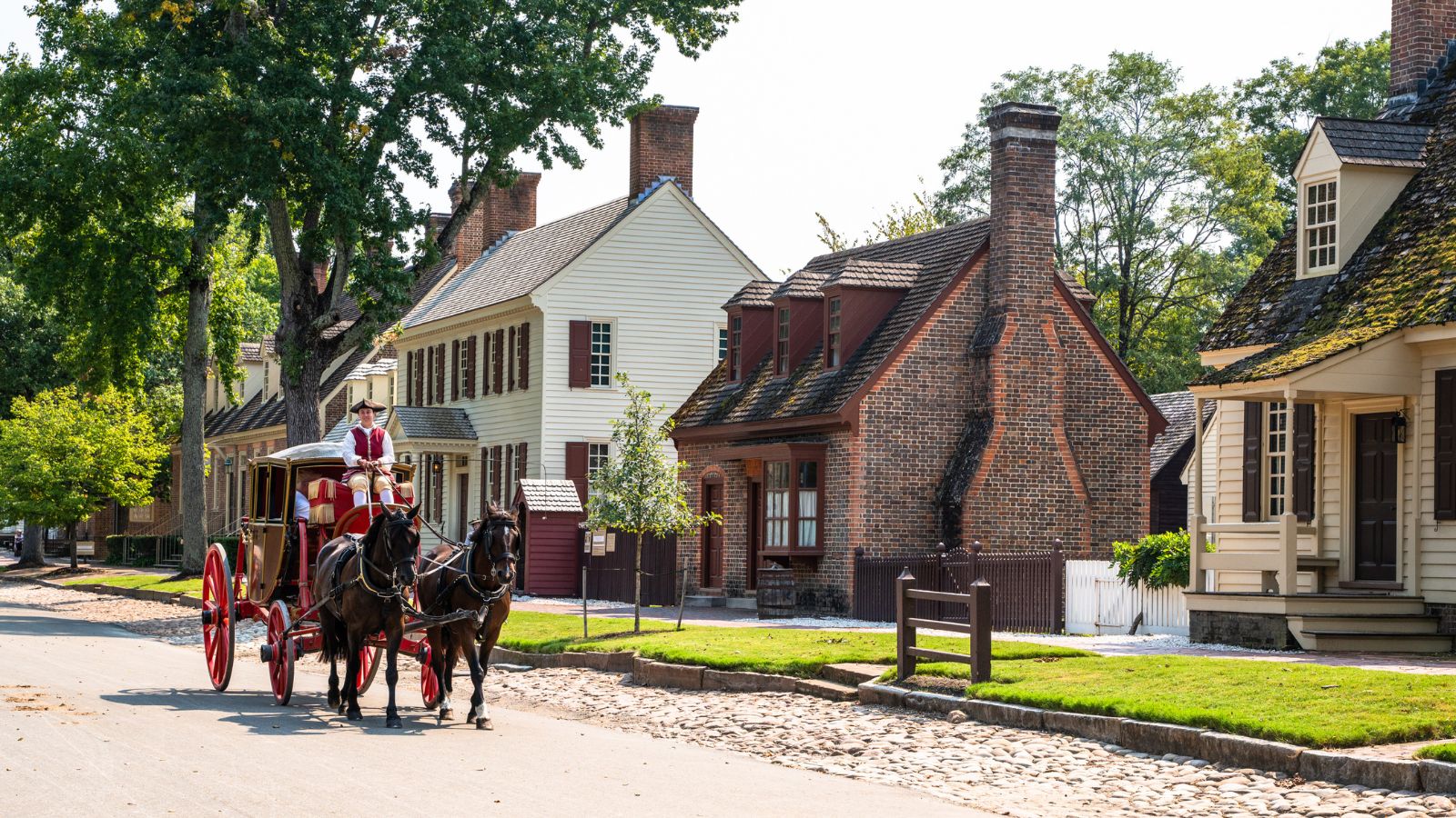 A photo of the Colonial Williamsburg street scene with 18th-century buildings.