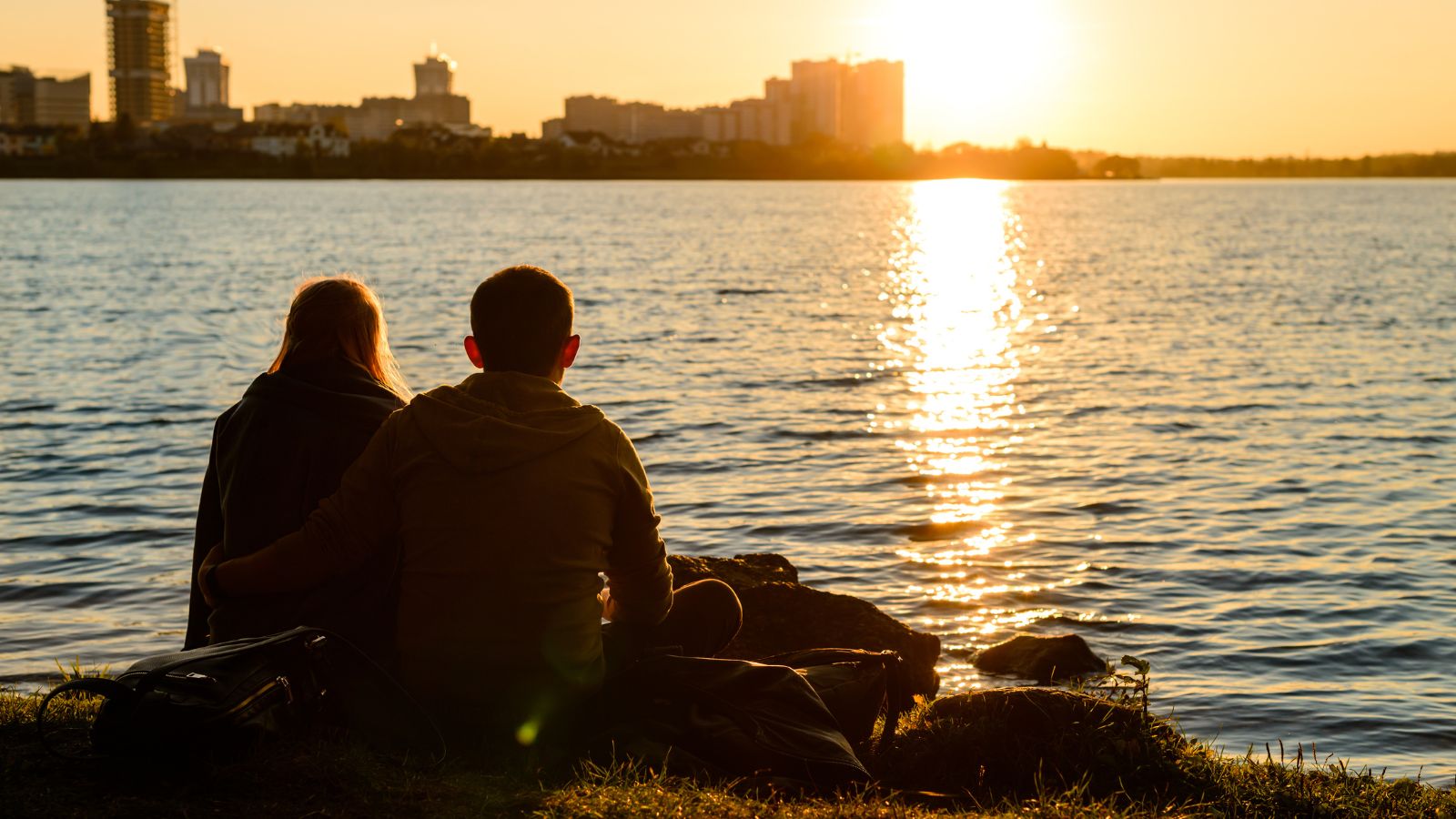 A photo of a Couple quiet shared sunset.