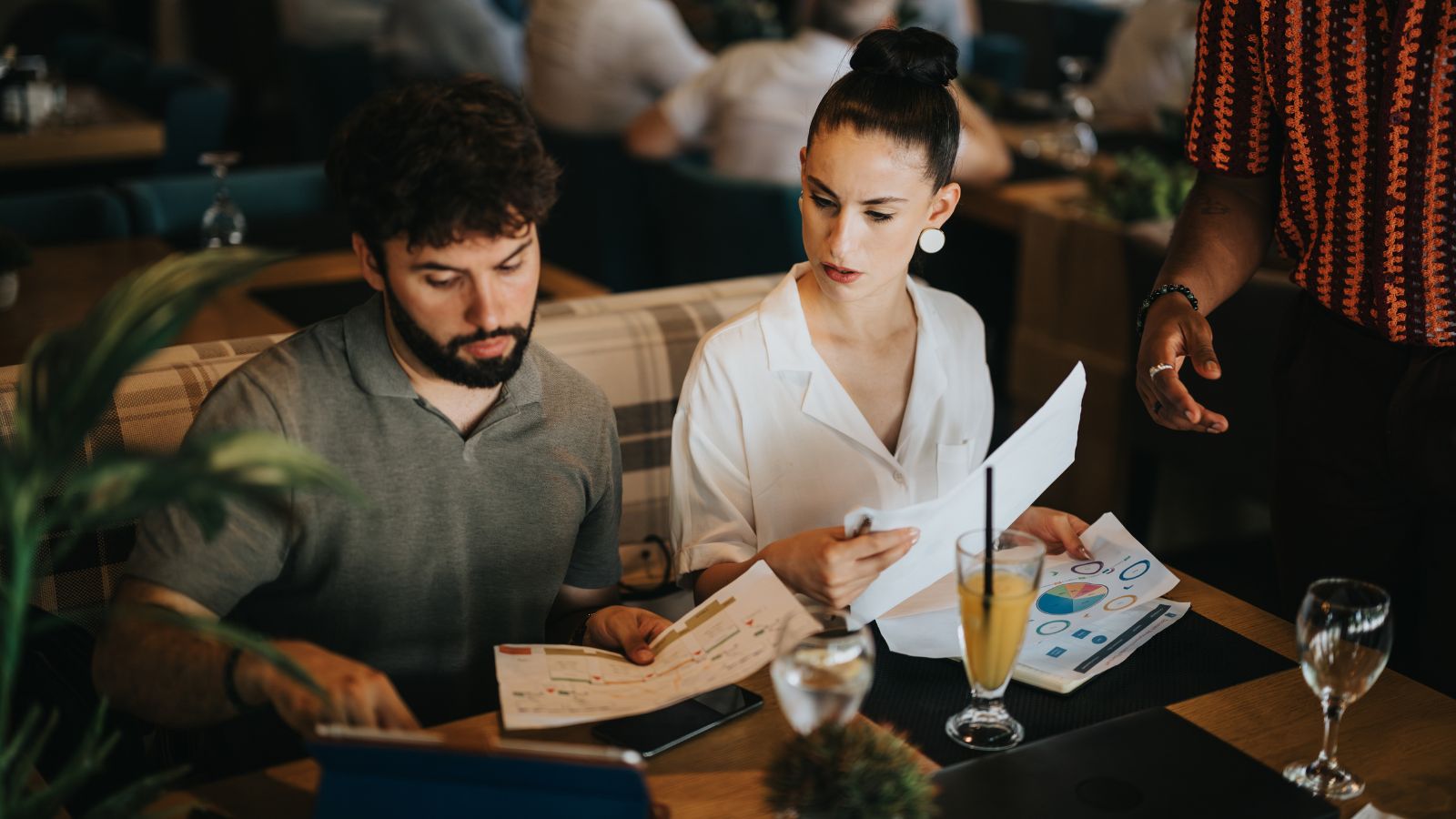 A photo of a Couple reviewing dinner reservations.