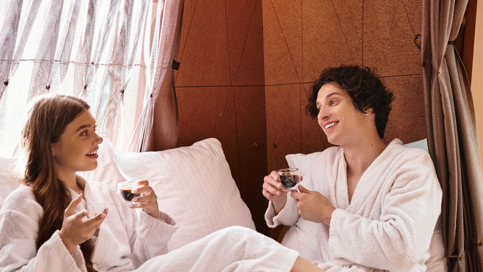 A photo that shows Couple relaxed hotel morning.