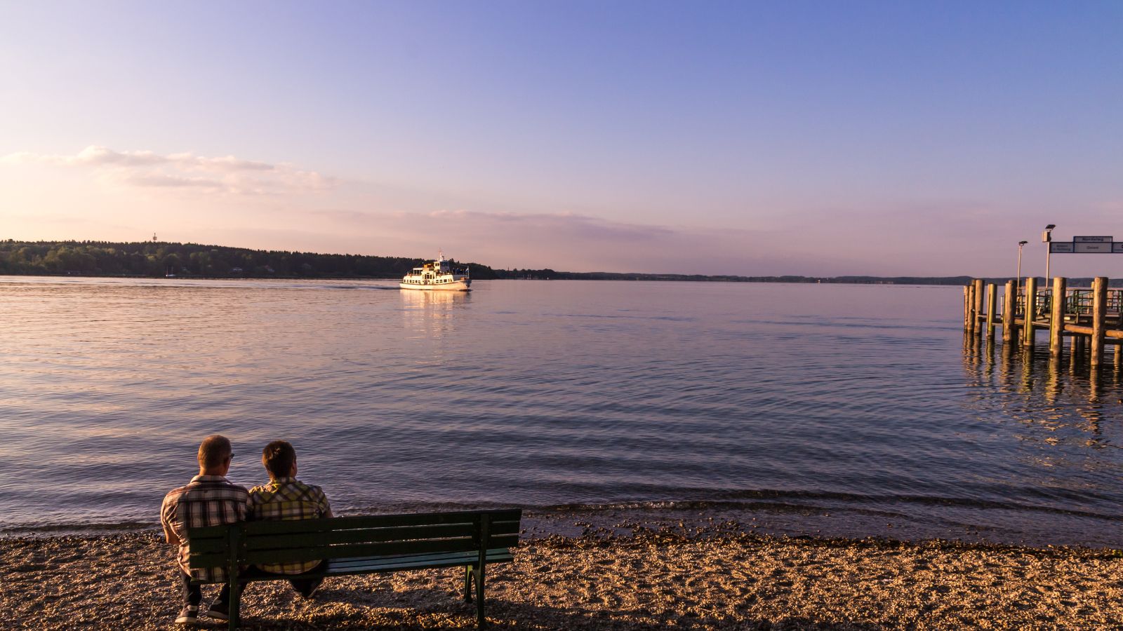 A photo of a couple, sitting enjoying the scene in front of them.