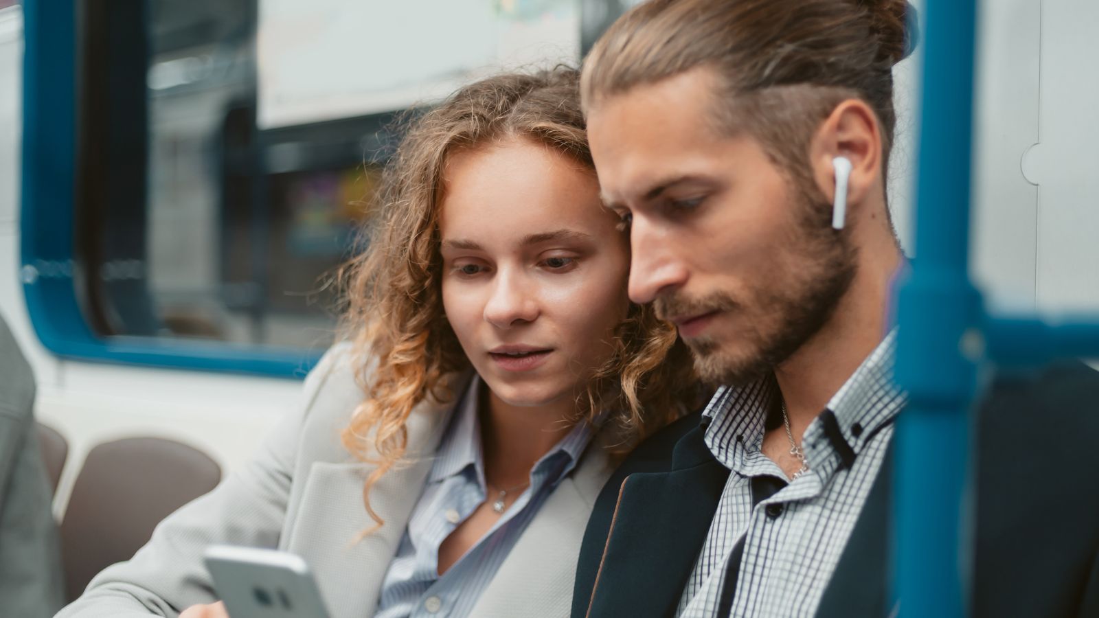 A photo of a Couple using city transit.